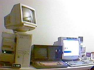 The book on the leftmost computer (Eddie) is the Red Hat Bible.